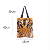 Cartoon tiger knitting lady WOMEN\'S TOTE BAGS